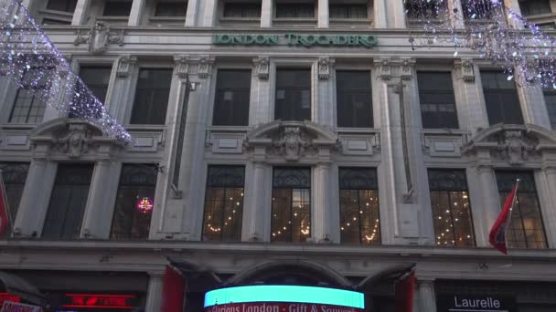 LONDON, ENGLAND - December 22: Centre London Cinema and Shopping Street in Leicester Square Theatreland in London People Walk Visit ( Ultra High Definition, Ultra HD, UHD, 4K, real time ) — Stock Video