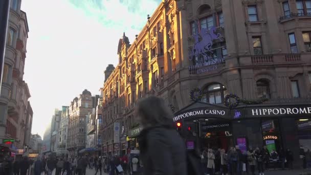 LONDON, ENGLAND - December 22: Centre London Cinema and Shopping Street in Leicester Square Theatreland in London People Walk Visit ( Ultra High Definition, Ultra HD, UHD, 4K, real time ) — Stock Video