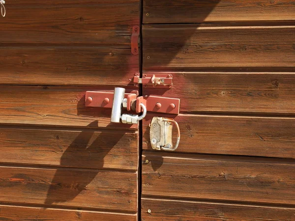 Wooden doors are closed on the lock — Stock Photo, Image