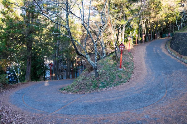 Curve road to mountain of Chureito Temple. There are red lantern