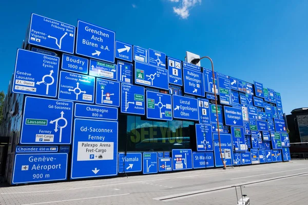 May 5, 2017 - Luzern, Switzerland: Signpost showing name of streets and cities in Switzerland. Decoration at one building in Swiss Museum of Transport. Stock Photo