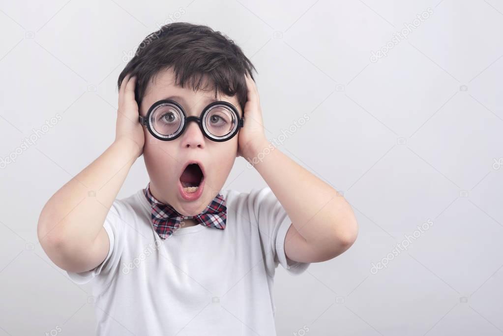 Surprised boy with glasses
