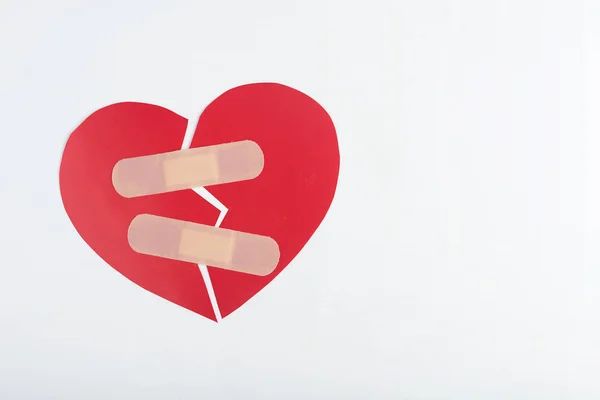 Red broken heart on white background — Stock Photo, Image