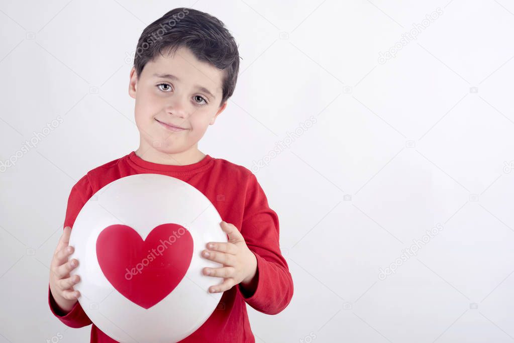 Smiling child with a heart
