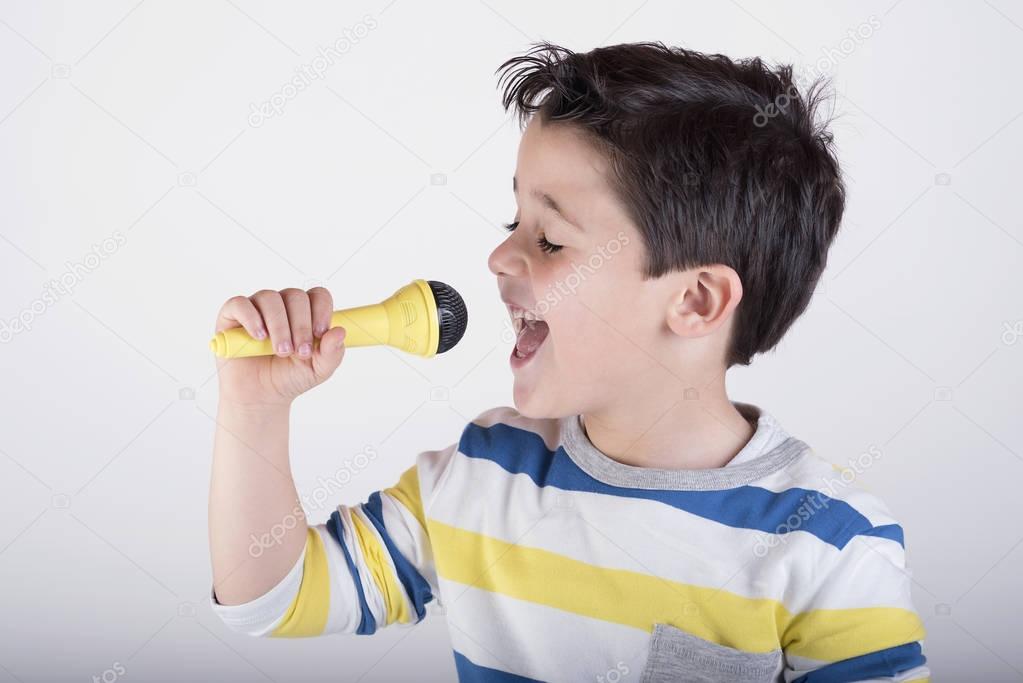 Boy singing to microphone