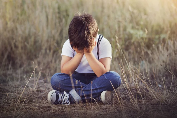 crying boy. Child crying sitting on the floor