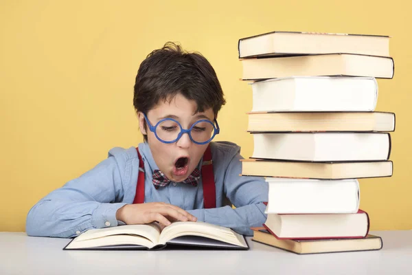 surprised boy reading a book
