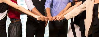 midsection of business people hand fist share together for Unity and teamwork concept. clipart