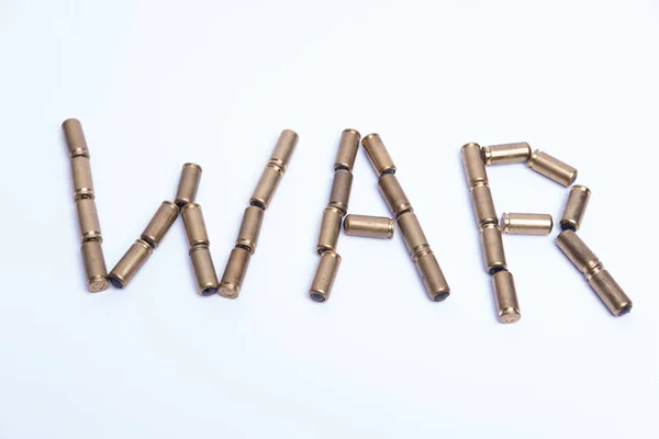 Word war constructed from bullets. Abstract message. Top view. — Stock Photo, Image