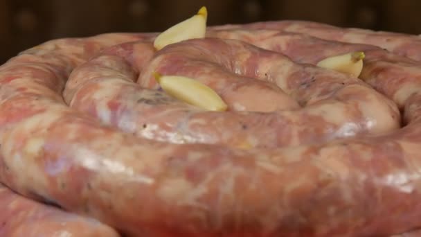 Homemade production of sausages. Putting intestine sausage with garlic. — Stock Video