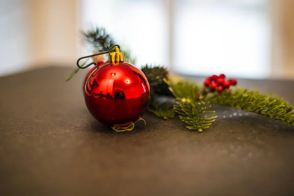 Christmas decoration with pine cone, berry and red ball and berries