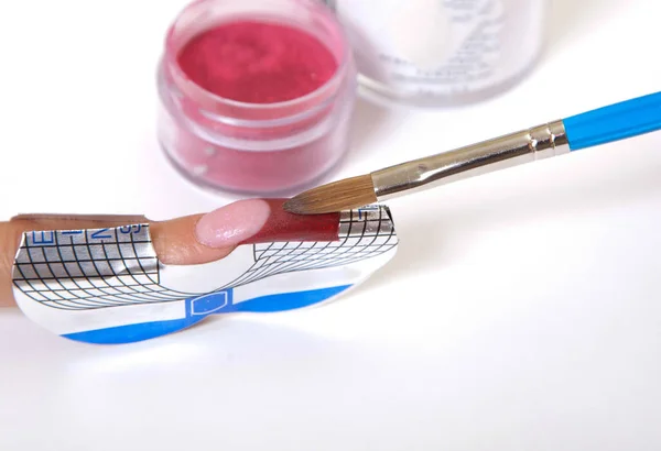 Manikür. Master yapmak uzantısı tırnak. Parmak portre 