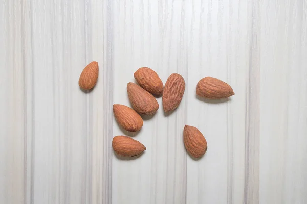 Almond nut on wood table image — Stock Photo, Image