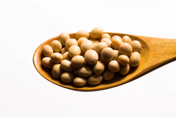 Soy beans  on wood spoon — Stock Photo, Image