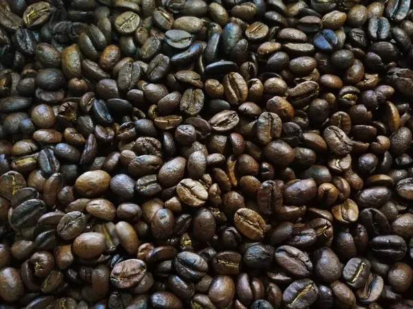 Grãos de café torrados usados como fundo . — Fotografia de Stock