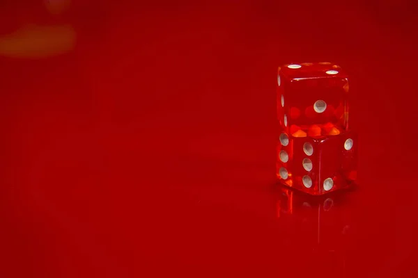 Two Red dice on bright red glossy background. — Stock Photo, Image
