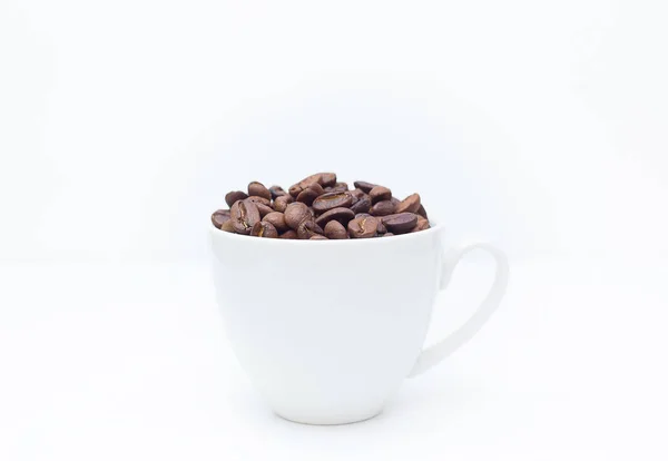 Roasted coffee beans on white background space modern style. — Stock Photo, Image