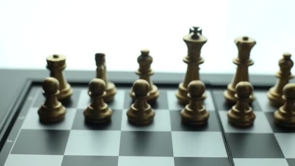 Spotlight On Chess Game In Progress Between Gold And Silver Pieces, Static  Shot Free Stock Video Footage Download Clips