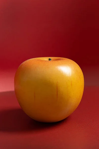 Apple on red background low light for food content — 스톡 사진