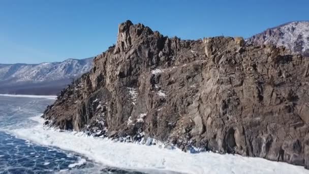 Aerial Perspective View of Beautiful Deep Blue Ice Textured Frozen Baikal Lake Surface and Coast from above Captured with a Drone at Sunny Winter Day in Russia — Stock Video