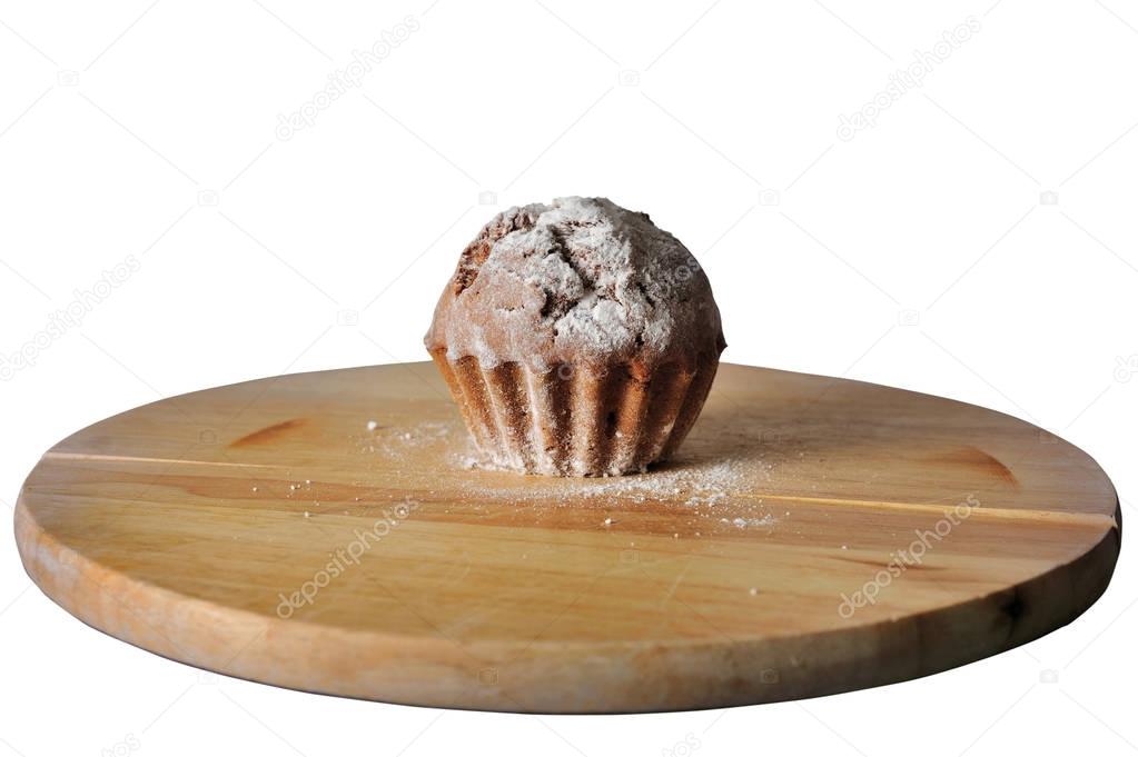 cupcake on wooden board with white background