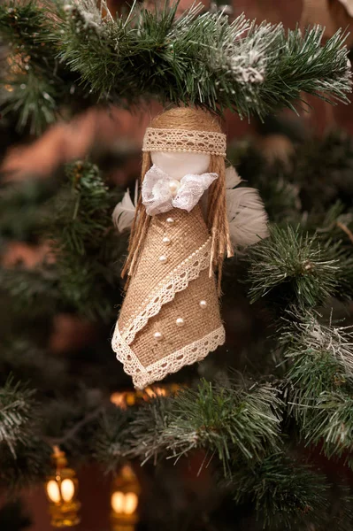 Handmade rustic toy on new year tree Stock Picture
