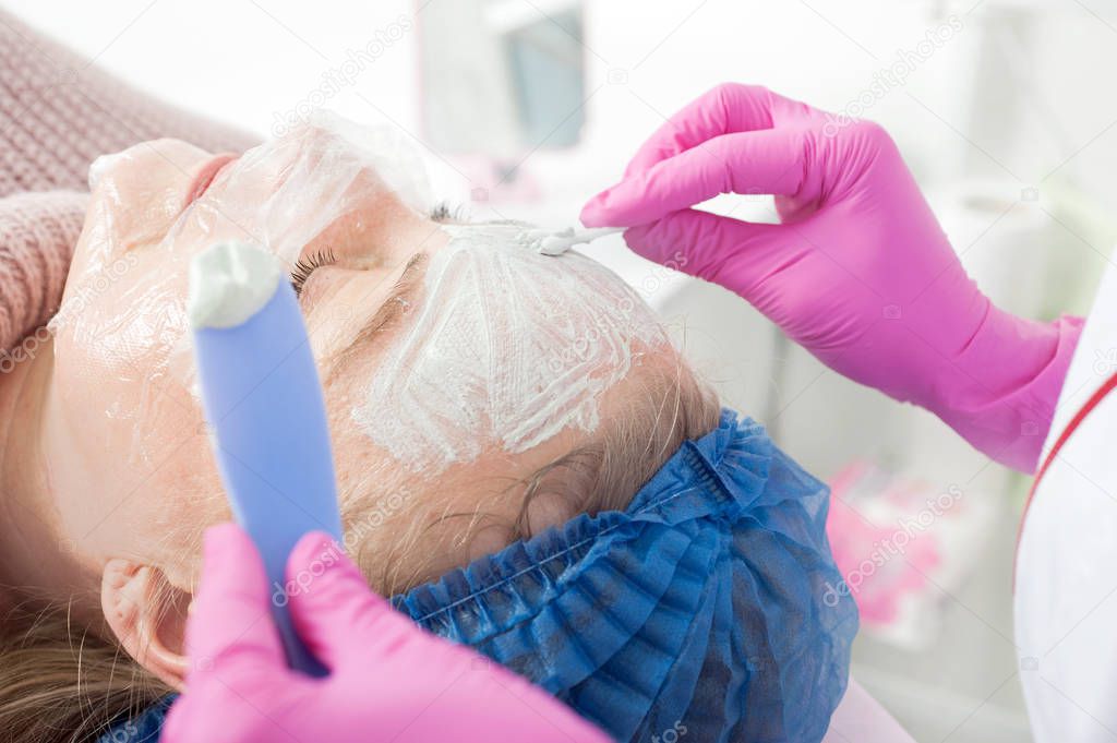 close up of procedure for applying antibacterial mask