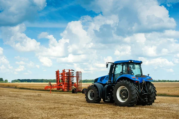 Blue Tractor Pulls Harrows Arable Land Field Preparation — Stock Photo, Image