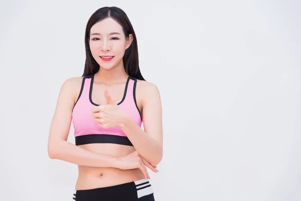 Diyet fitness egzersiz Spor seksi vücut Asyalı kadın thumbing kadar co
