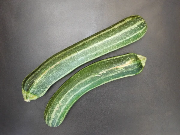 Zucchini on wooden background — Stock Photo, Image