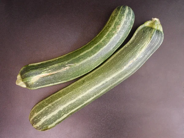 Zucchini on wooden background — Stock Photo, Image