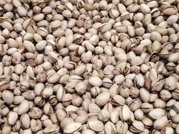 Toasted and salted pistachios. Food background.