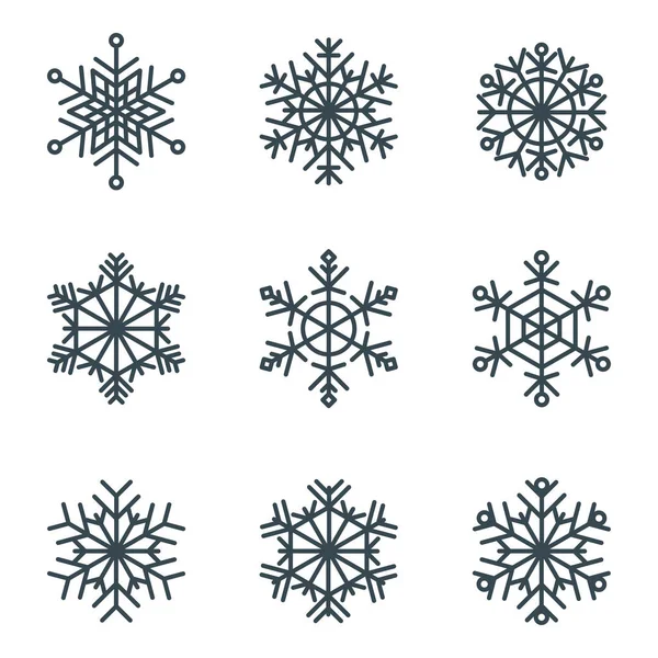 Set di eleganti fiocchi di neve vettoriali geometrici traforati . — Vettoriale Stock