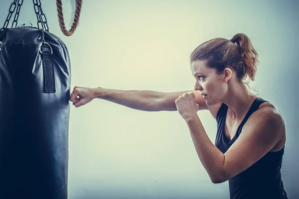 Young blonde woman in a boxing gym for a workout — Stock Photo, Image