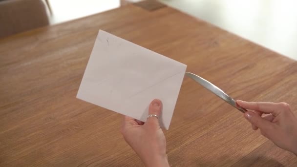 Opening cover with letter knife, in anticipation of new messages — Stock Video