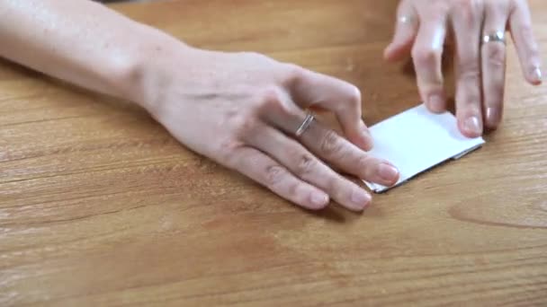 Folded paper into squares as a basis for origami — Stock Video