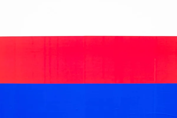 Tricolor op een papieren achtergrond als symbool van kunst. Wit, rood, blauw — Stockfoto