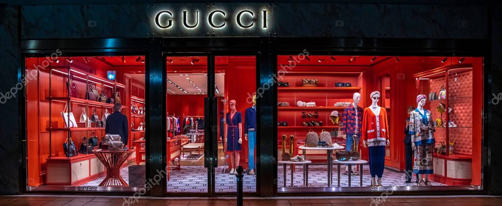 Marbella - January 13, 2020: shop window of gucci shop on night street.