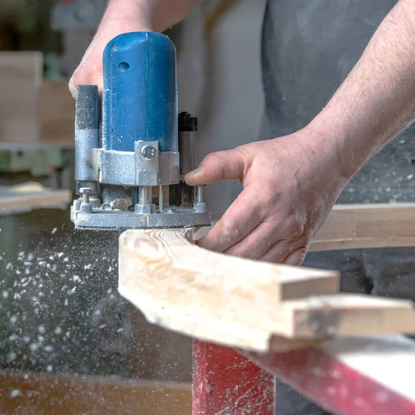 detail of electric milling cutter in joinery during wood milling