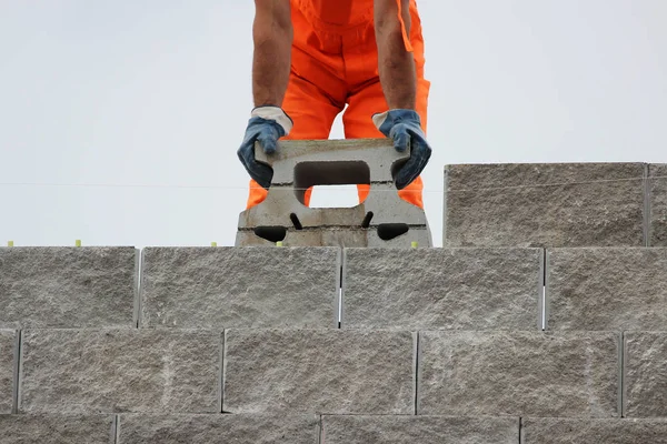 Bricklayer putting down another row of bricks in site during the construction of the viaduct — Stock Image Bricklayer Putting Another Row Bricks Site Construction Viaduct Royalty Free Stock Images