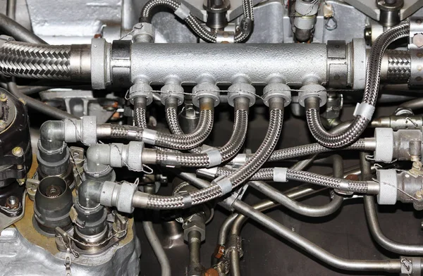 the internal structure of the aircraft engine, with hydraulic, fuel pipes and other hardware and equipment, army aviation, military aircraft and aerospace industry