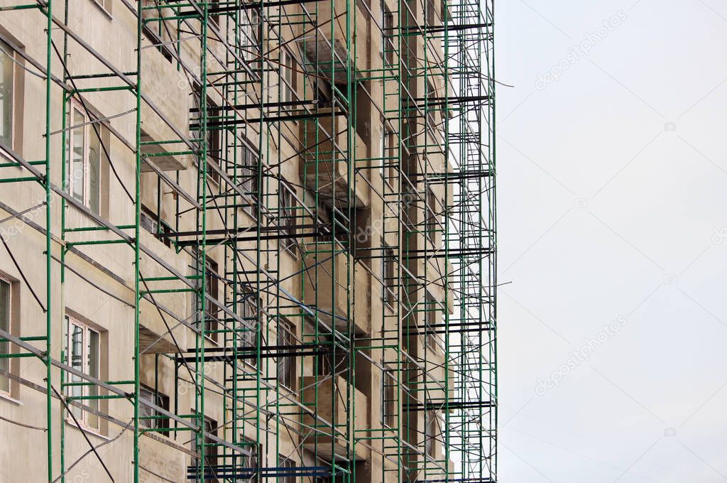 green construction metal timber in beige house under  at the time of finishing and plastering