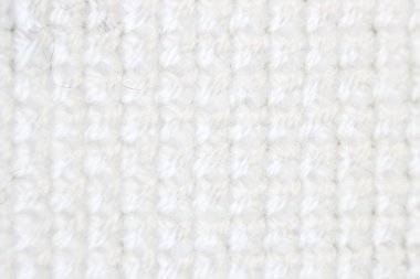 Makro çekim parça nakış deseni beyaz iplik el yapımı nakış, beyaz kumaş üzerinde çapraz dikiş biçimi.