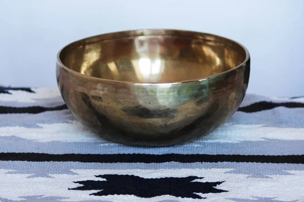 One singing Tibetan brass bowl for relaxation and meditation
