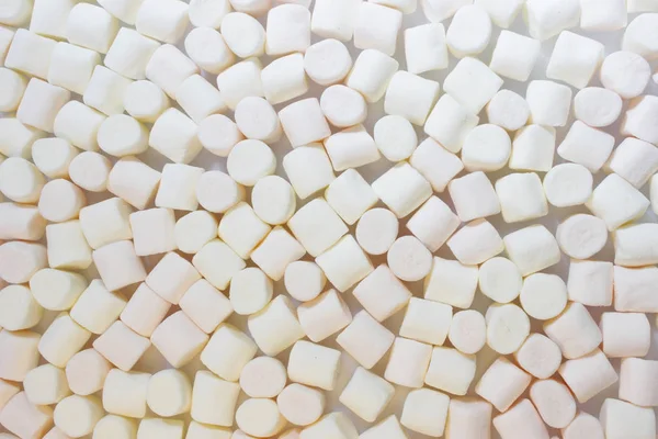 Wiele małych cylindrycznych kawałków światła Zefir różowy i biały, wyroby cukiernicze — Zdjęcie stockowe