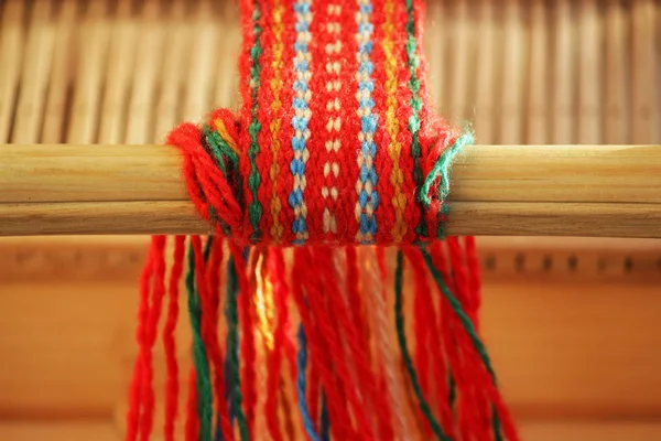 Weaving mini machine for making belts with patterns. Folk art, handmade. Detail