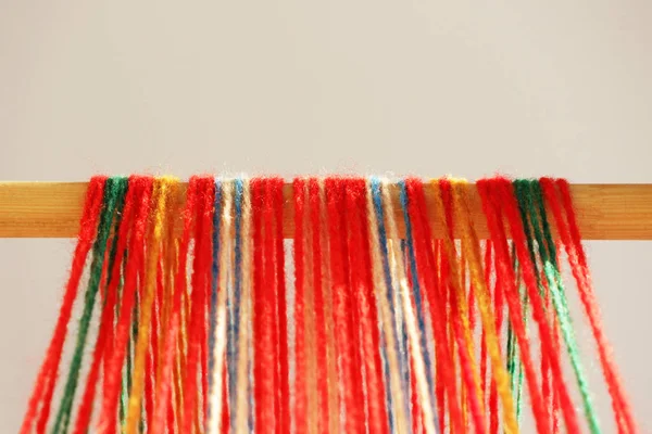 Weaving mini machine for making belts with patterns. Folk art, handmade. Detail