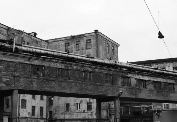 old industrial brick building, abandoned factory, industrial area, criminal territory.