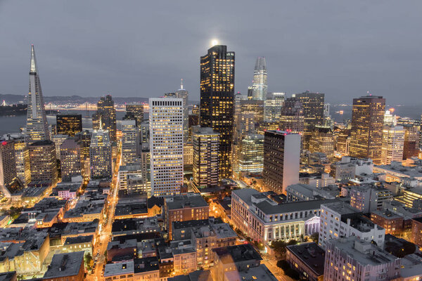 Moonshine over San Francisco Downtown. Aerial view of San Francisco Financial District as seen from a building rooftop in Nob Hill.