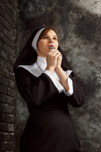 Religious nun in religion concept against dark background — Stock Photo, Image